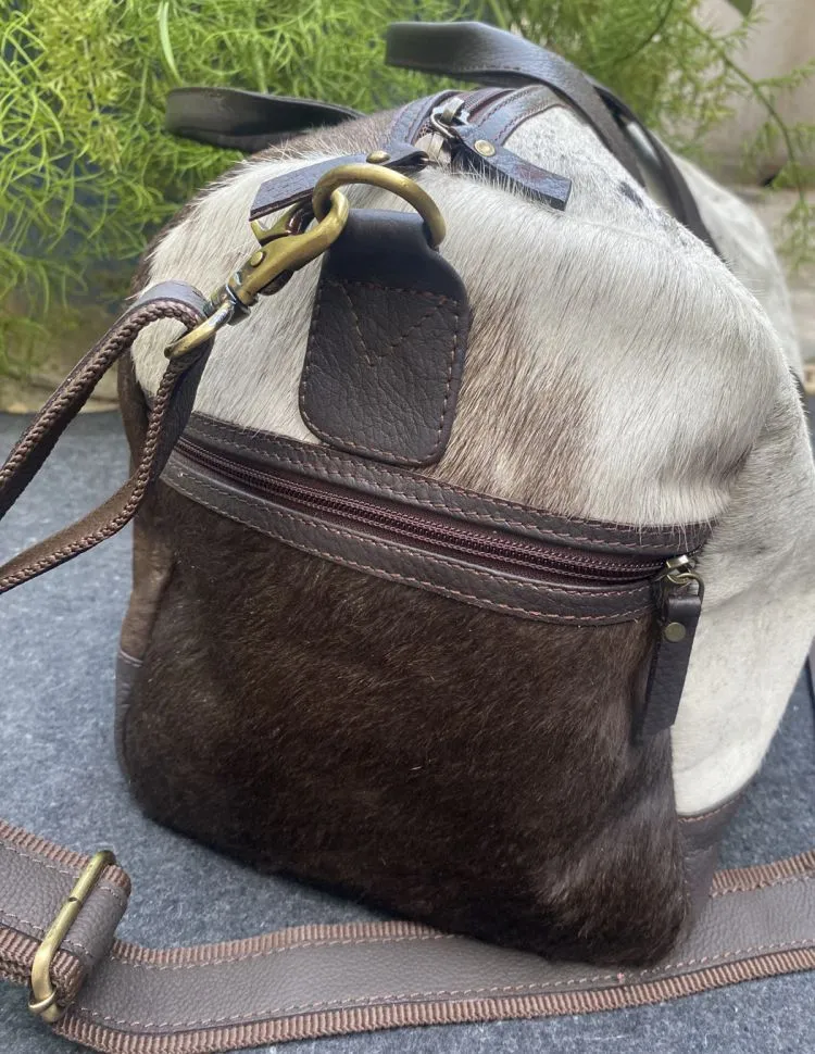 Hair on cowhide white and brown duffle bag