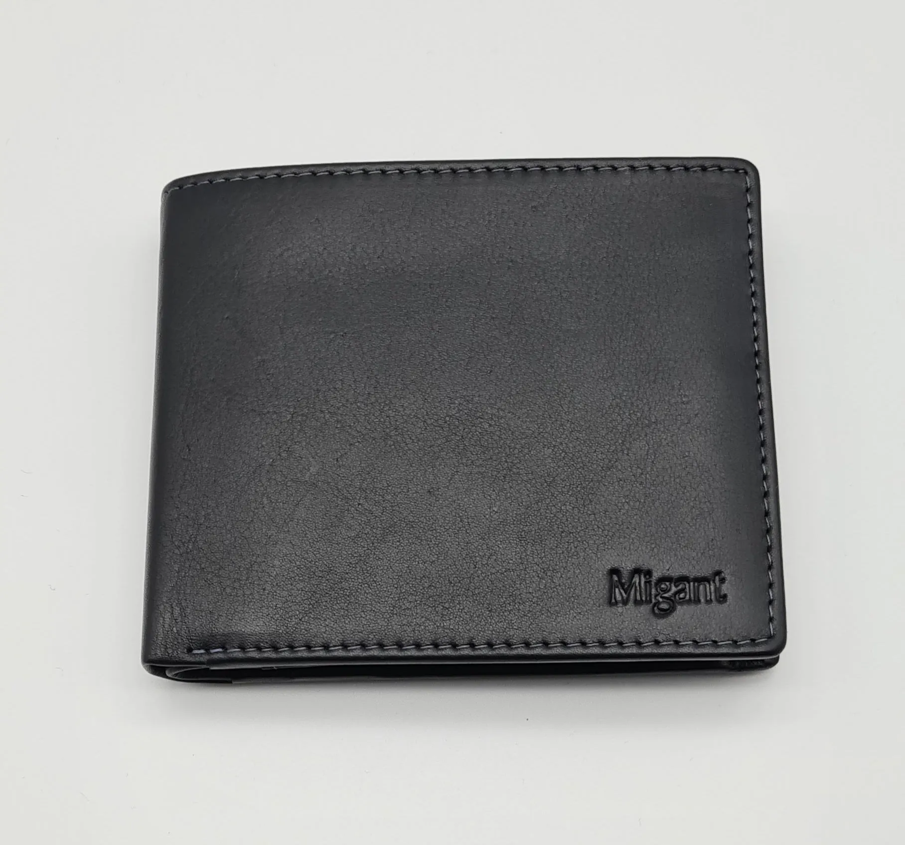 Migant Design black leather wallet in box 6550